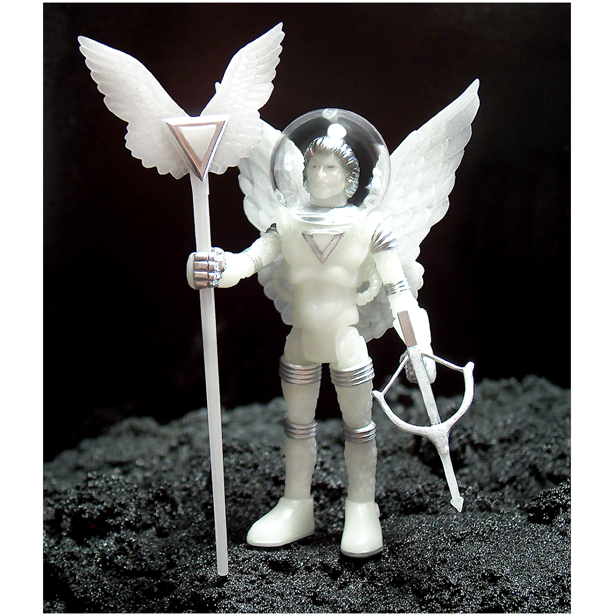 A white COMMANDER COMET COSMIC RADIATION action figure with wings and a spear.