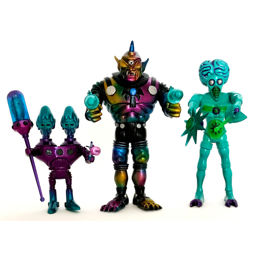 Three 2017 GALACTIC HOLIDAY EDITION TOPHEROY EDITION action figures are standing next to each other.
