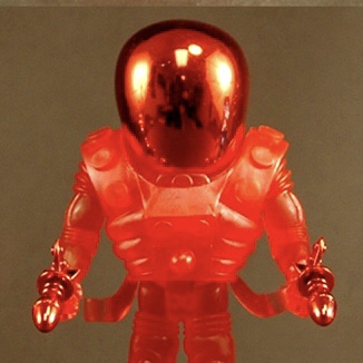 A figure in a 2012 HOLIDAY CYCLOPS WITH RED ACC'S FACTORY BAG is standing on a grey background.