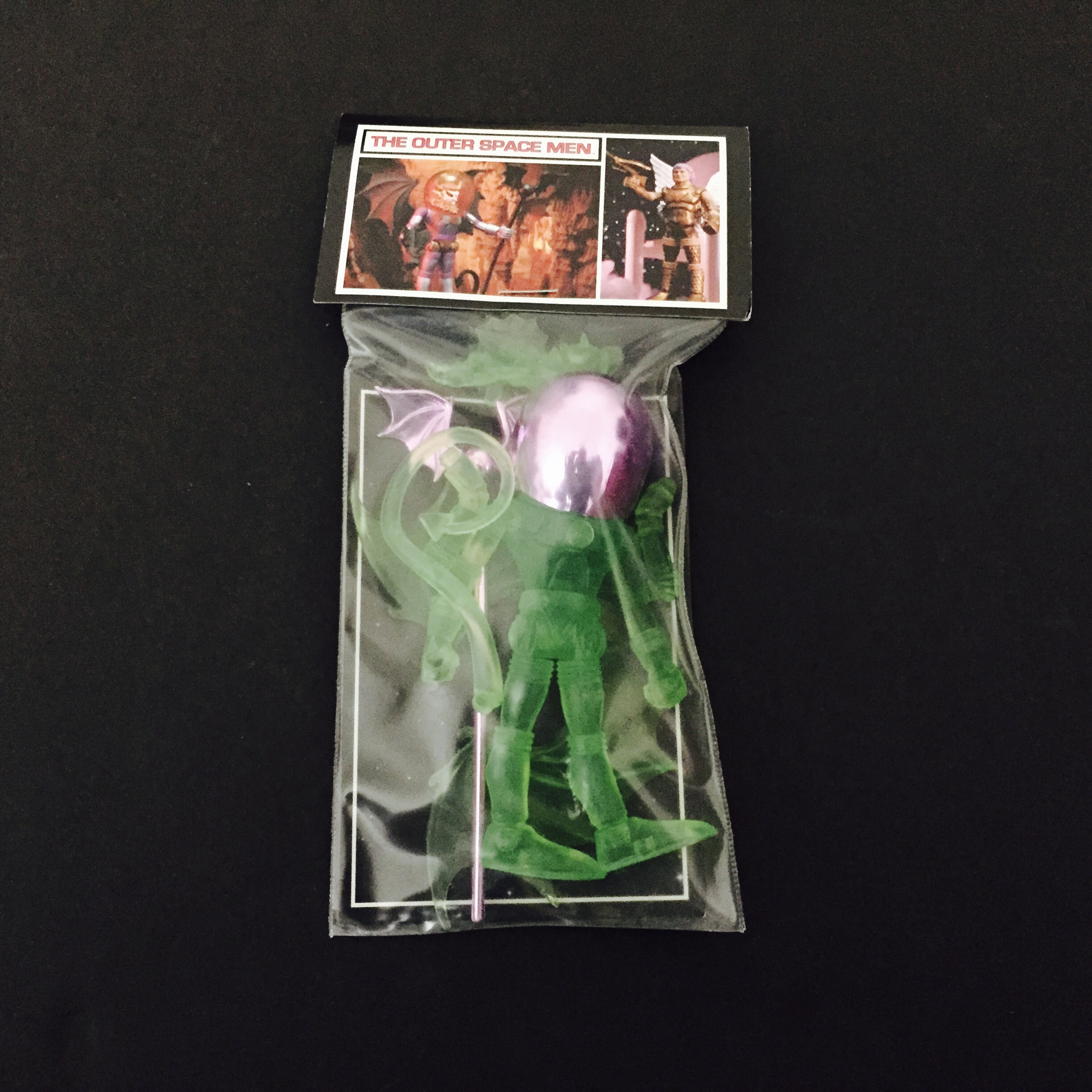 A 2011 GALACTIC HOLIDAY MYSTRON GREEN WITH LAVENDER ACCESSORIES plastic figure in a package.