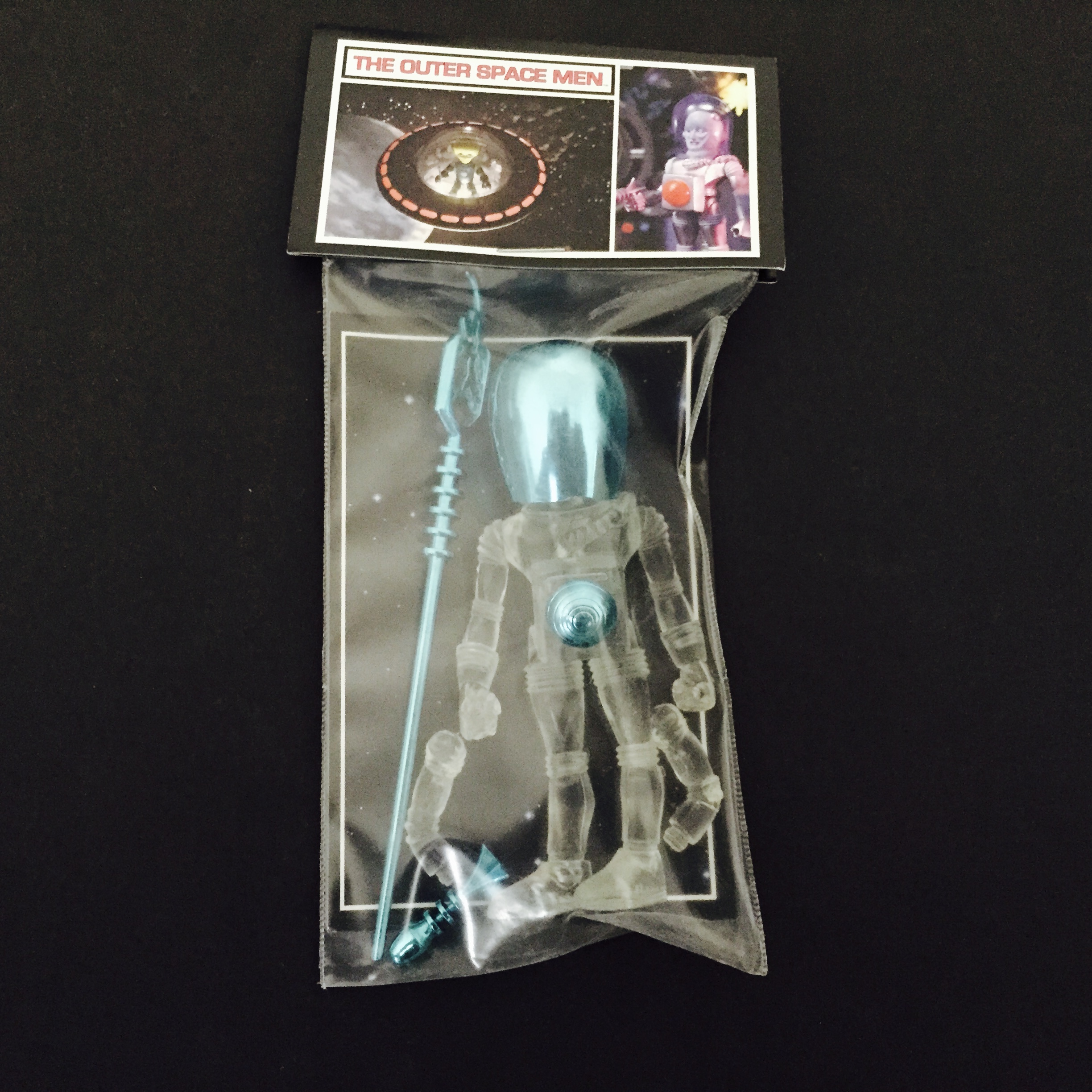 An 2011 GALACTIC HOLIDAY ELECTRON+ CLEAR WITH BLUE ACC'S action figure in a package with a blue light.