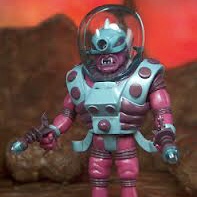 A pink and blue CYCLOPS 2016 ZARDURAC ONELL COSMIC CREATOR EXCLUSIVE LIMITED EDITION action figure is standing on a rock.