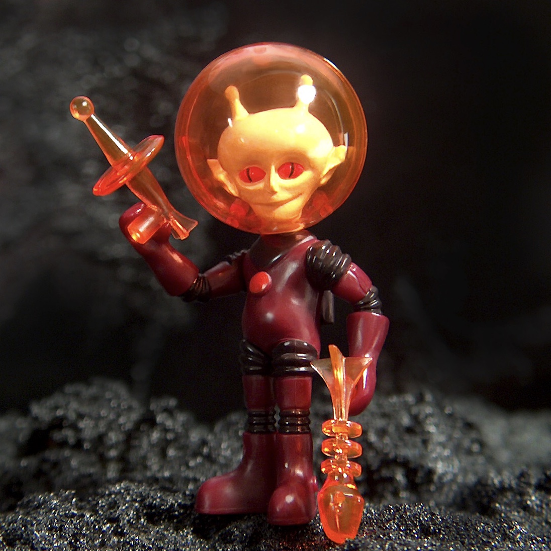 A figure in a ALPHA 7 2016 ZEKROYAS ONELL COSMIC CREATOR EXCLUSIVE LIMITED EDITION space suit holding a knife.