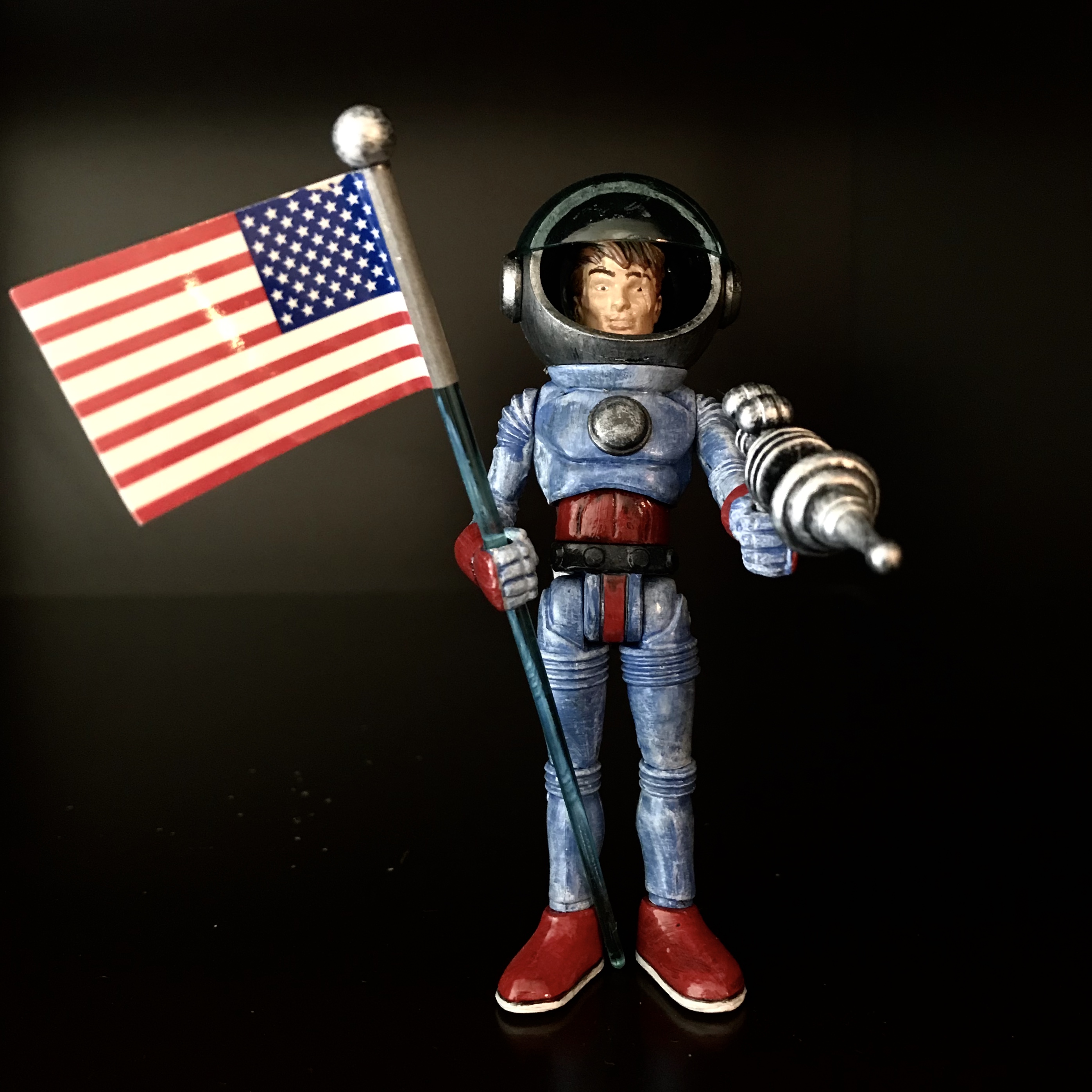 A JACK ASTEROID TOPHEROY ONE OFF NYCC EXCLUSIVE HAND PAINTED LOOSE FIGURE A holding an american flag.