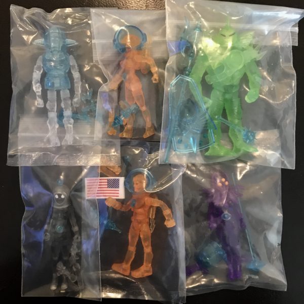 Six 2013 COMPLETE SET OF SDCC EXCLUSIVE VERSION FACTORY BAGGED FIGURES on a table.