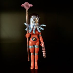 A 2013 HORROSCOPE INFINITY LOOSE FIGURE GEM MINT NEVER PLAYED WITH in a space suit holding a stick.