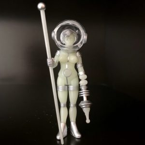 A TERRA FIRMA COSMIC RADIATION figure in a space suit holding a stick.