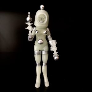 A figure in a space suit holding the HORROSCOPE COSMIC RADIATION.