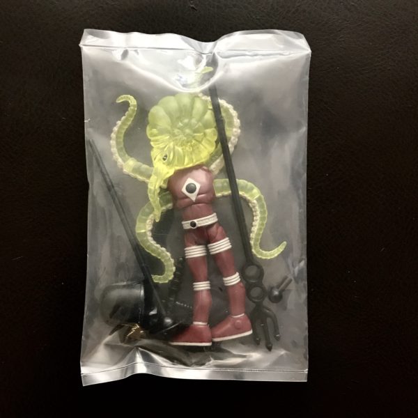 An ASTRO NAUTILUS 2018 REDBORG SYNDICATE ONELL COSMIC CREATOR EXCLUSIVE LIMITED EDITION figure in a plastic bag.