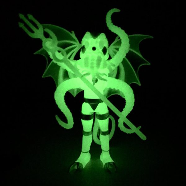 Glow in the dark figure of 021 CTHULHU COSMIC RADIATION holding a sword.