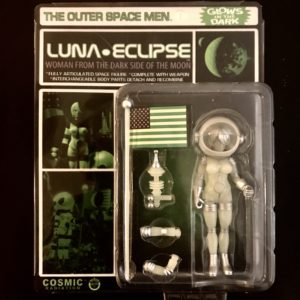 A figure of a LUNA ECLIPSE COSMIC RADIATION L/E CARDED EDITION female astronaut in a package.