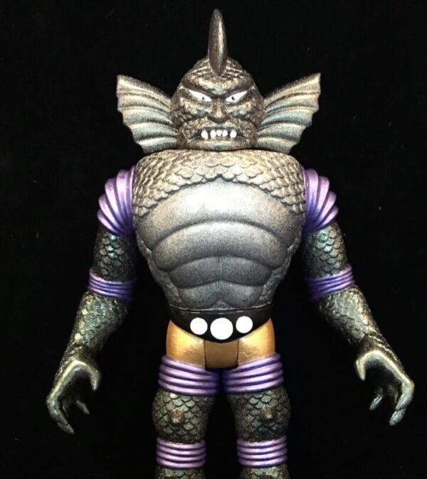 An COLOSSUS REX METALMANIA EDITION ULTRA RARE ONE OFF 12" VINYL FIGURE with a purple and purple outfit.