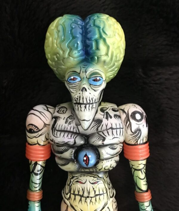 A ORBITRON MARS ATTACKS EDITION MICRORUN OF 3 12" VINYL FIGURE #2 with a green head and blue eyes.