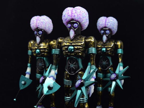 A group of ORBITRON KAIJU COLLISEUM EDITION MICRORUN OF 3 12" VINYL FIGURE with purple and blue heads.